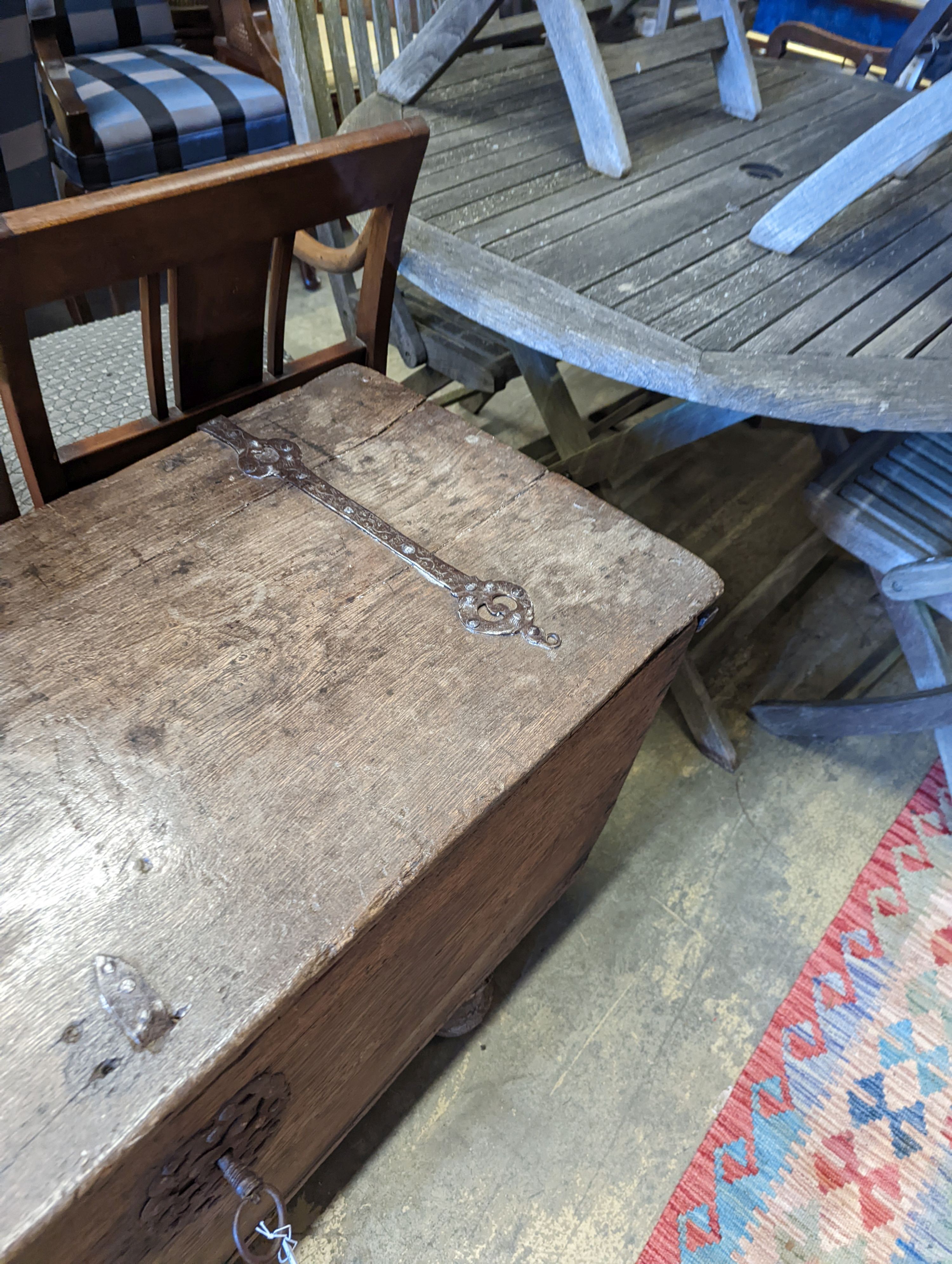 An 18th century Continental wrought iron mounted oak coffer, on pad feet, length 124cm, depth 50cm, height 66cm